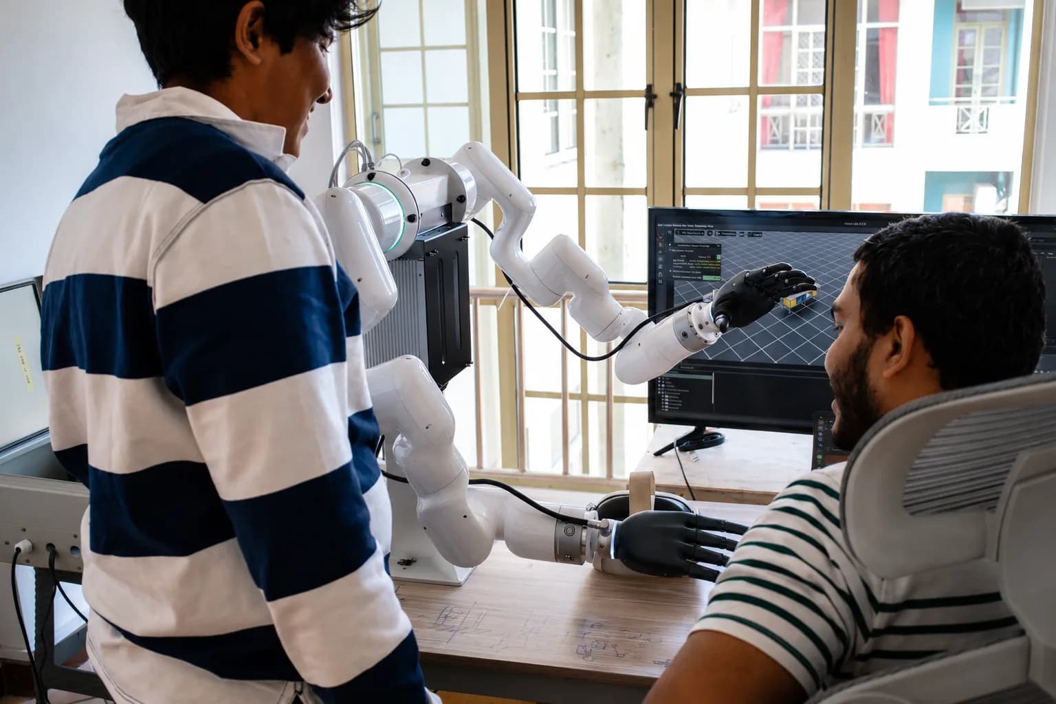 Veyrion team collaborating around robotics, software, and engineering work